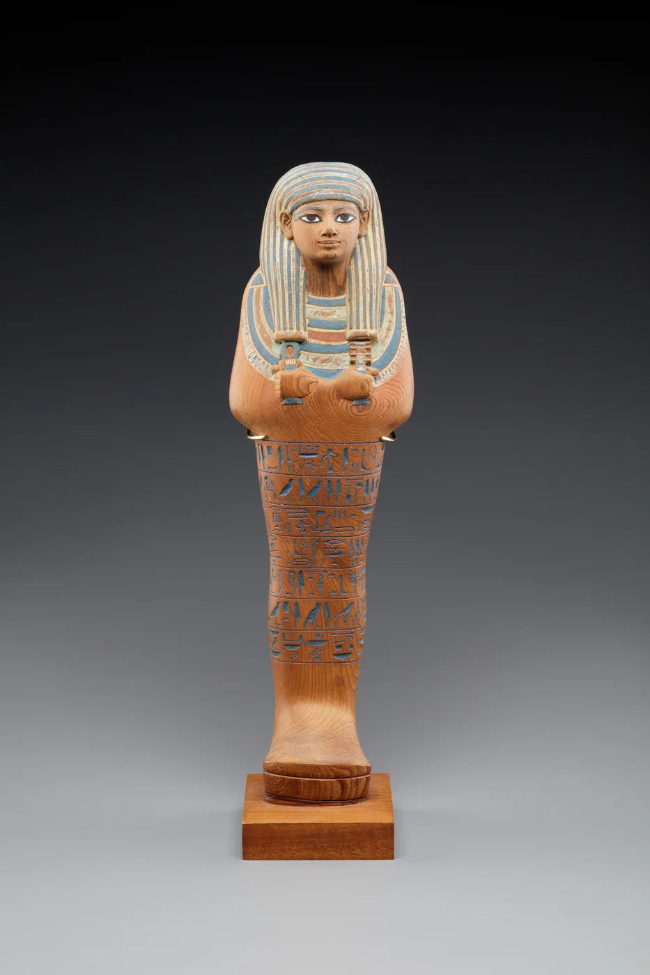 Shabti of Yuya; cedar, paint, egyptian blue.