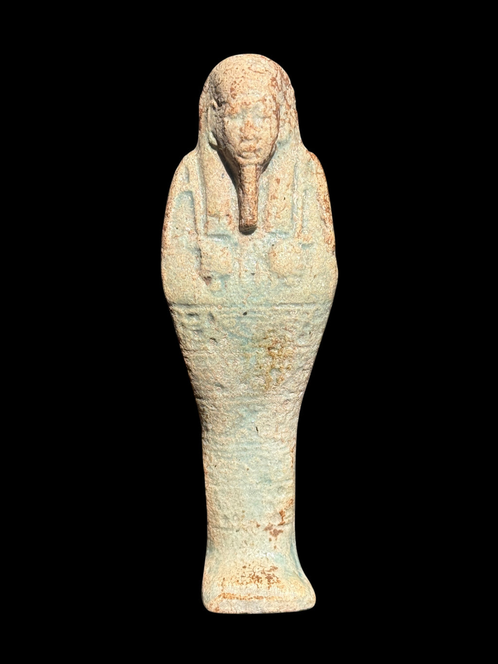 Front view of an ushabti with blue-green and beige colouring, a long headdress and flared base, 9.5 cm tall, item SHB-004.