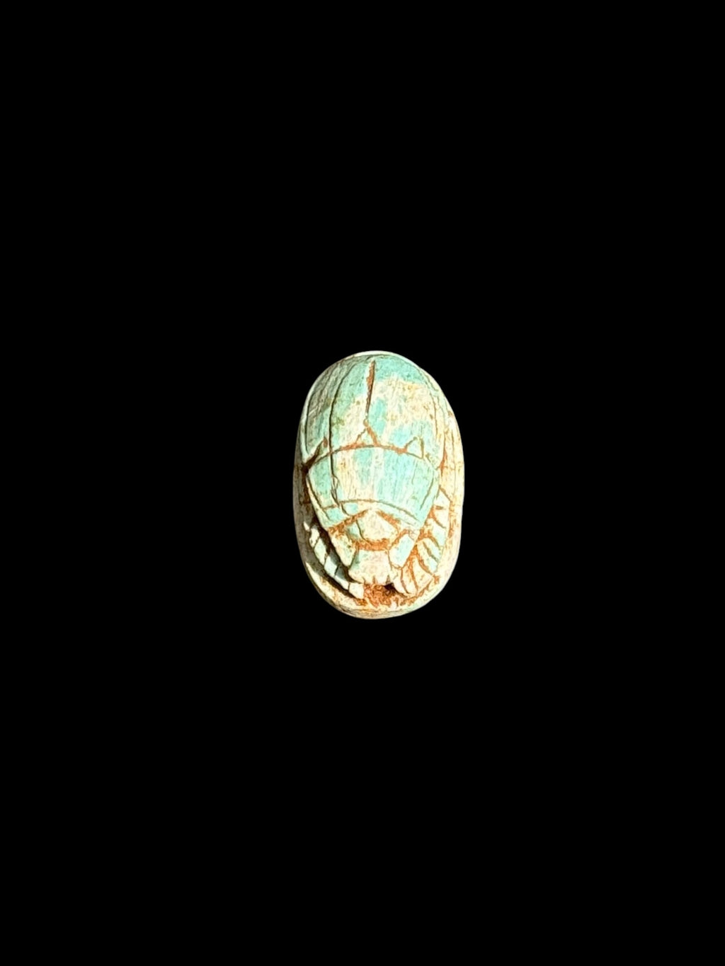 Top view of Egyptian scarab SC-056, showing pale turquoise and cream tones.