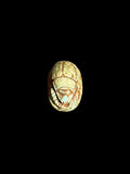 Top view of Egyptian scarab SC-070, showing pale green and cream tones with brown accents.