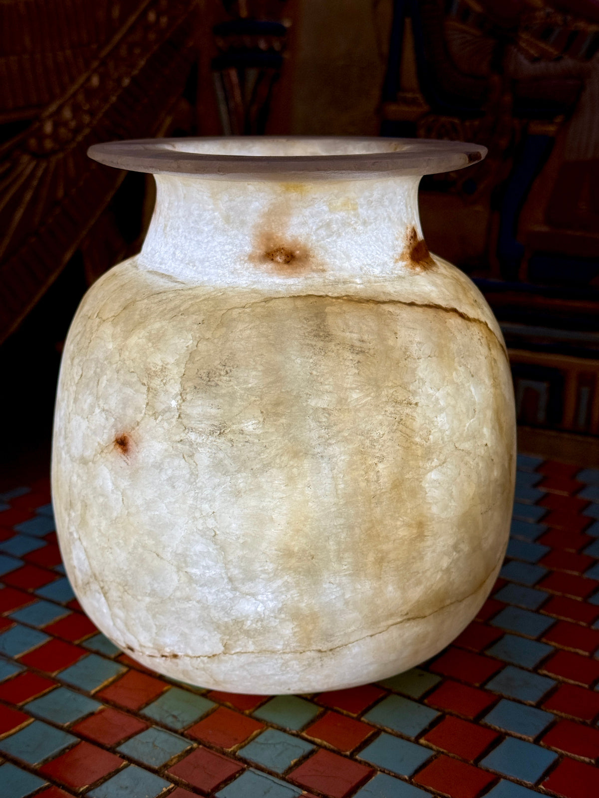 Cream alabaster vase with a rounded body, short neck, flared rim and fine golden veining — additional view 2.