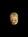 Top view of Egyptian scarab SC-049, showing mottled cream and golden-brown tones.