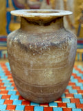 Alabaster vase with dark chestnut-coloured neck and shoulder bands, fine horizontal lines and a flared rim — unlit full view.