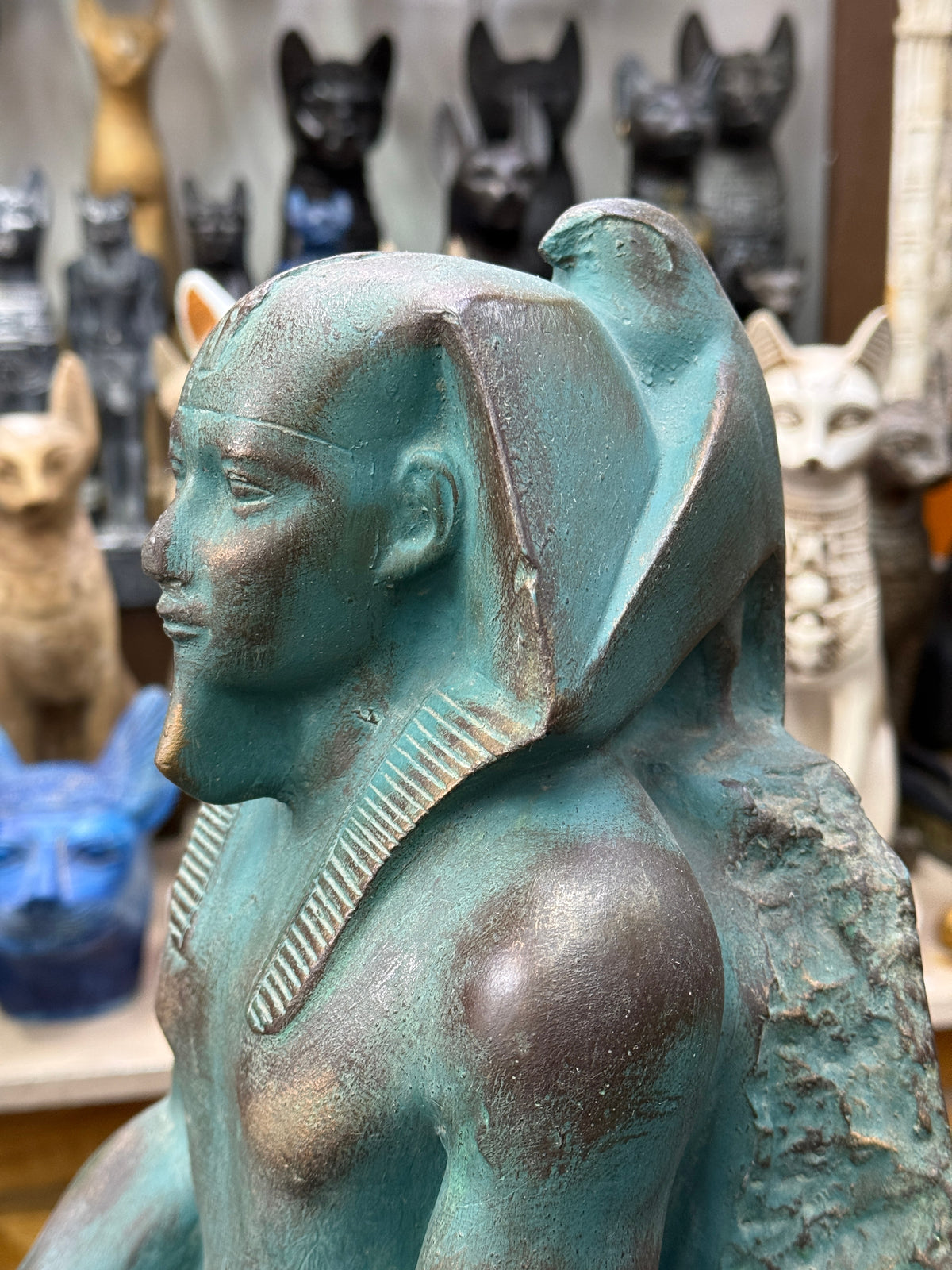Close side view of Khafre’s head with the falcon Horus immediately behind his headdress.