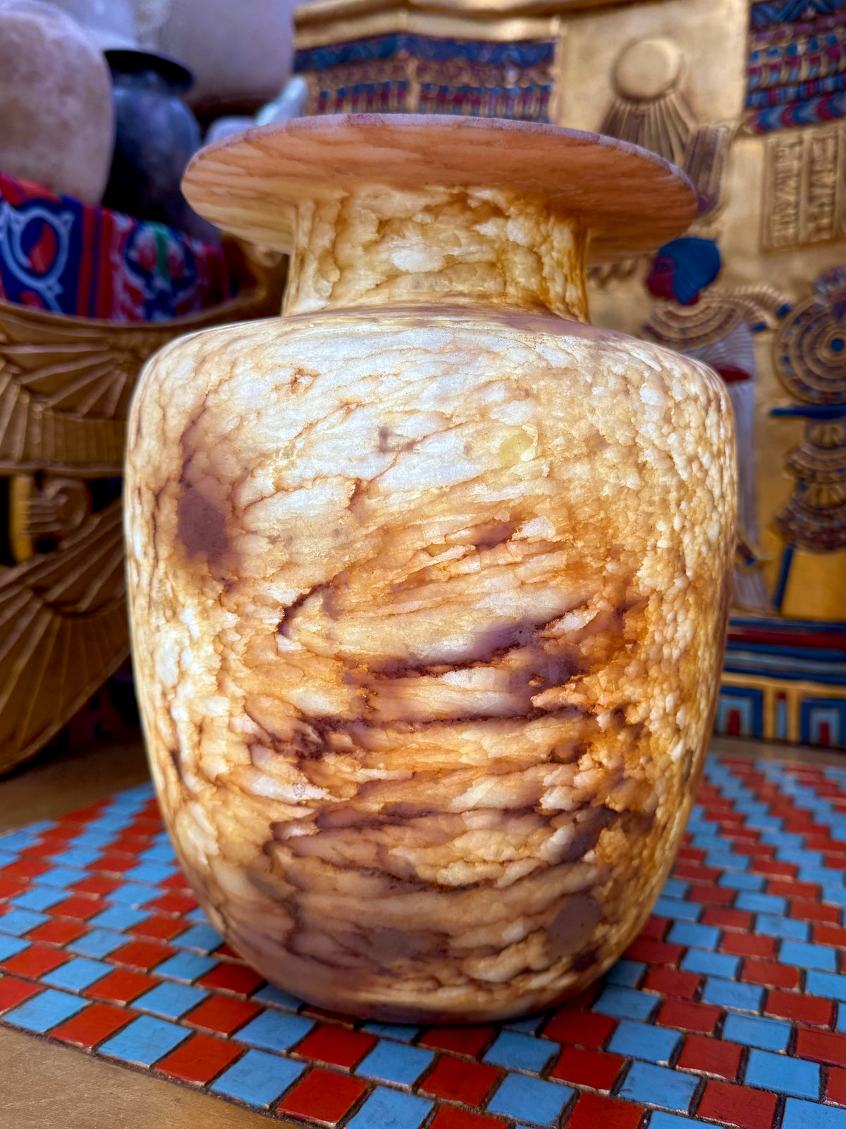 Broad alabaster vase with a low flared neck and layered honey, cream and brown veining — additional view 1.