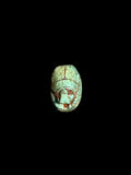 Top view of Egyptian scarab SC-053, showing blue-green tones with darker accents around the head.