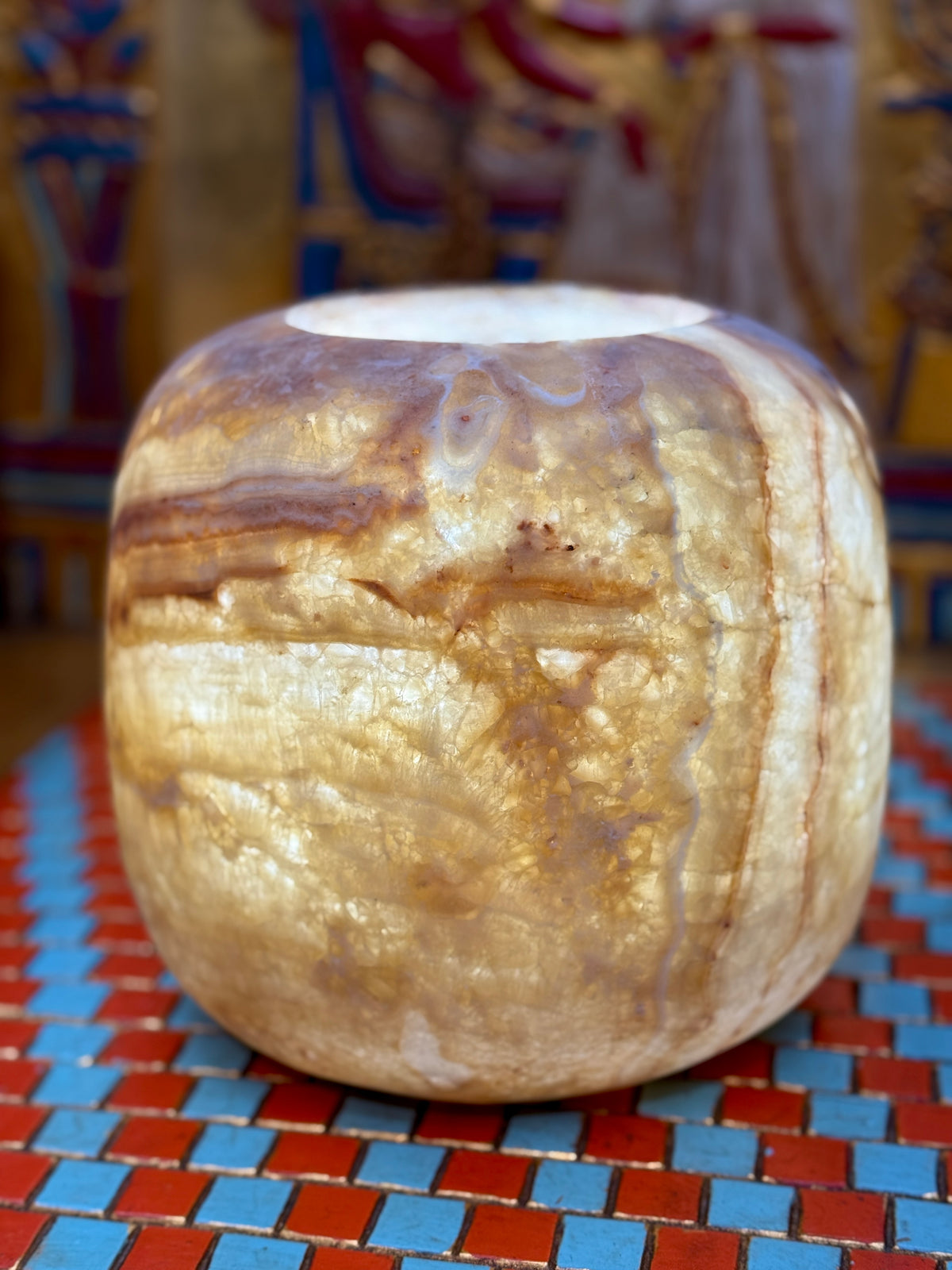 Low rounded alabaster vase with cascading honey-coloured patterns, smoky brown bands and an open rim — additional view 2.