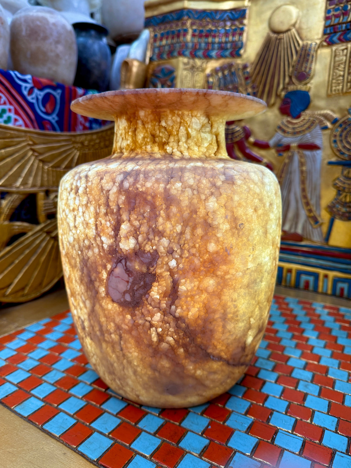 Broad alabaster vase with a low flared neck and layered honey, cream and brown veining — additional view 2.