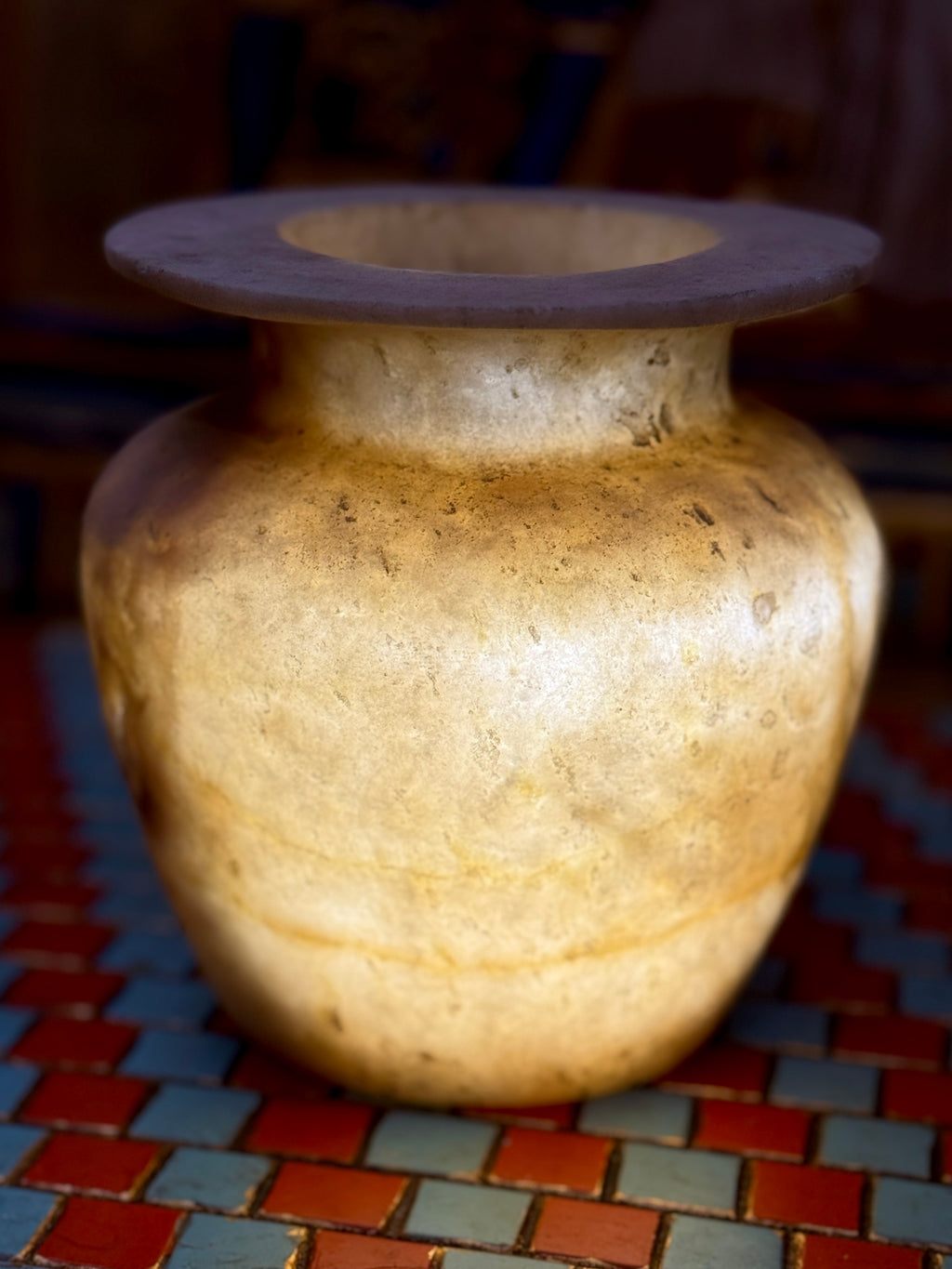 Small golden-cream alabaster vase with a rounded body, short neck and broad flared rim — additional view 1.