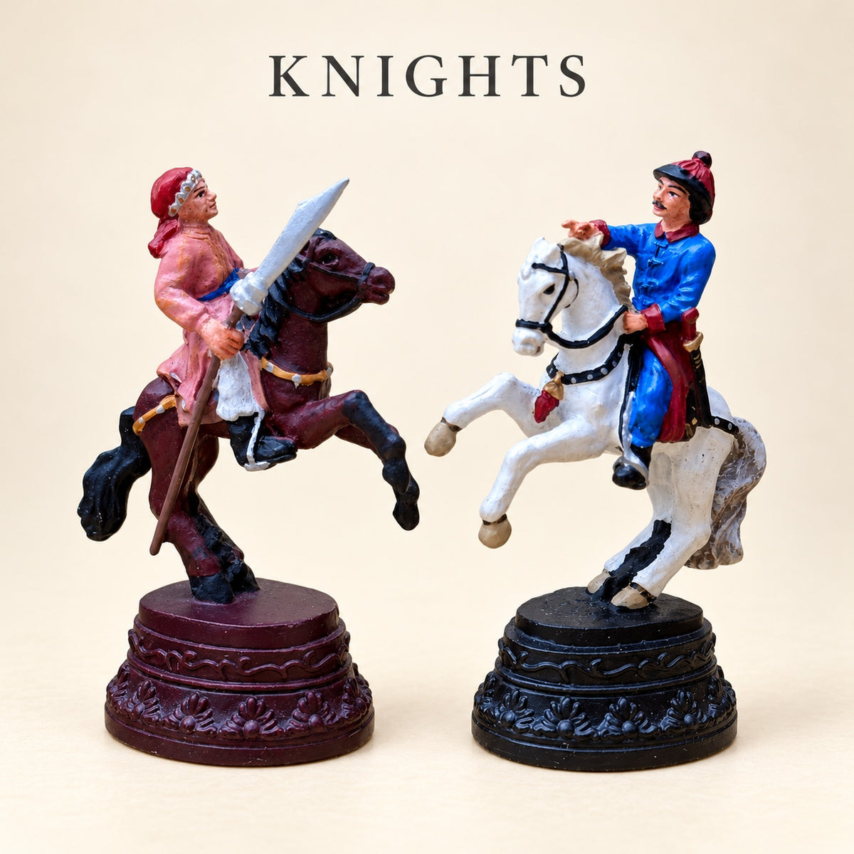 Chinese Dynasties pewter knight pieces depicting riders on a brown horse and a white horse.
