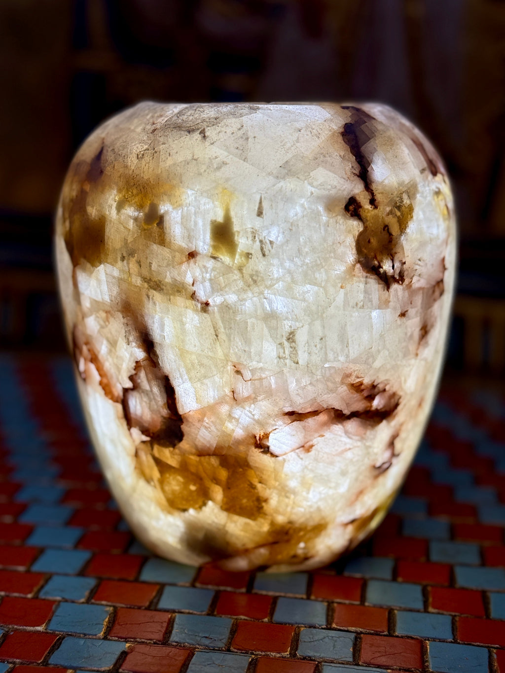 Rounded cream alabaster vase with chestnut-brown veins, curved shoulders and an open rim — additional view 1.