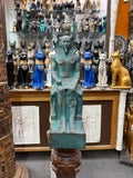Full front view of the seated Khafre statue, showing the royal headdress, lion-headed throne and green patina-style finish.