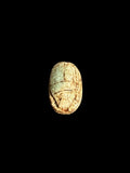 Top view of Egyptian scarab SC-071, showing pale green and ochre tones.