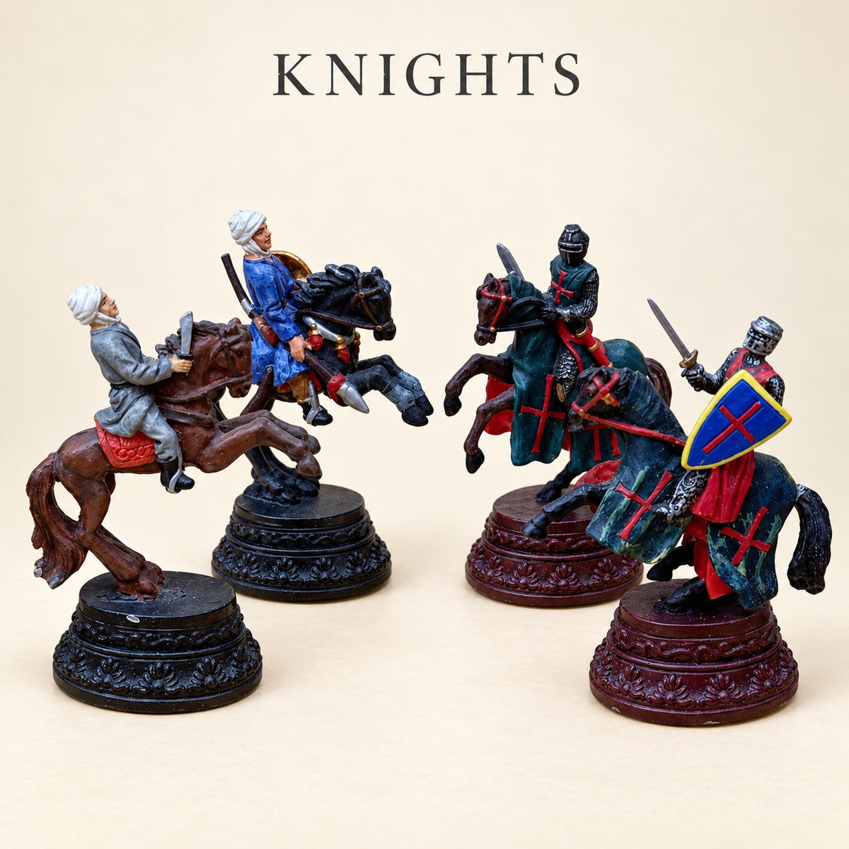 Four Crusaders vs. Arabs pewter knight pieces depicting armed riders on brown and black horses.