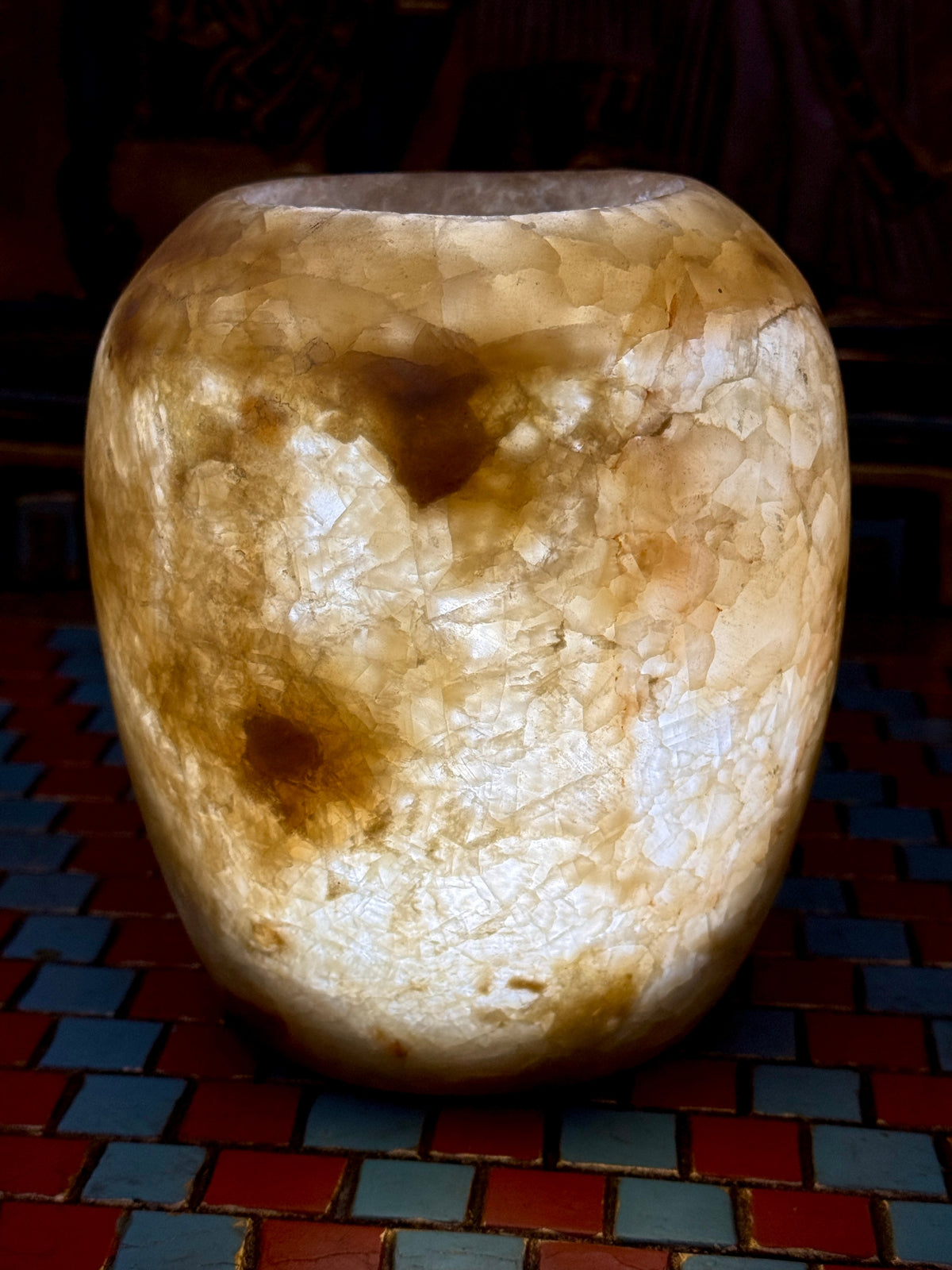 Small rounded alabaster vase with cloudy cream areas, honey-coloured patches and fine veining — additional view 1.