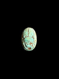 Top view of Egyptian scarab SC-059, showing blue-green tones with darker outlines.