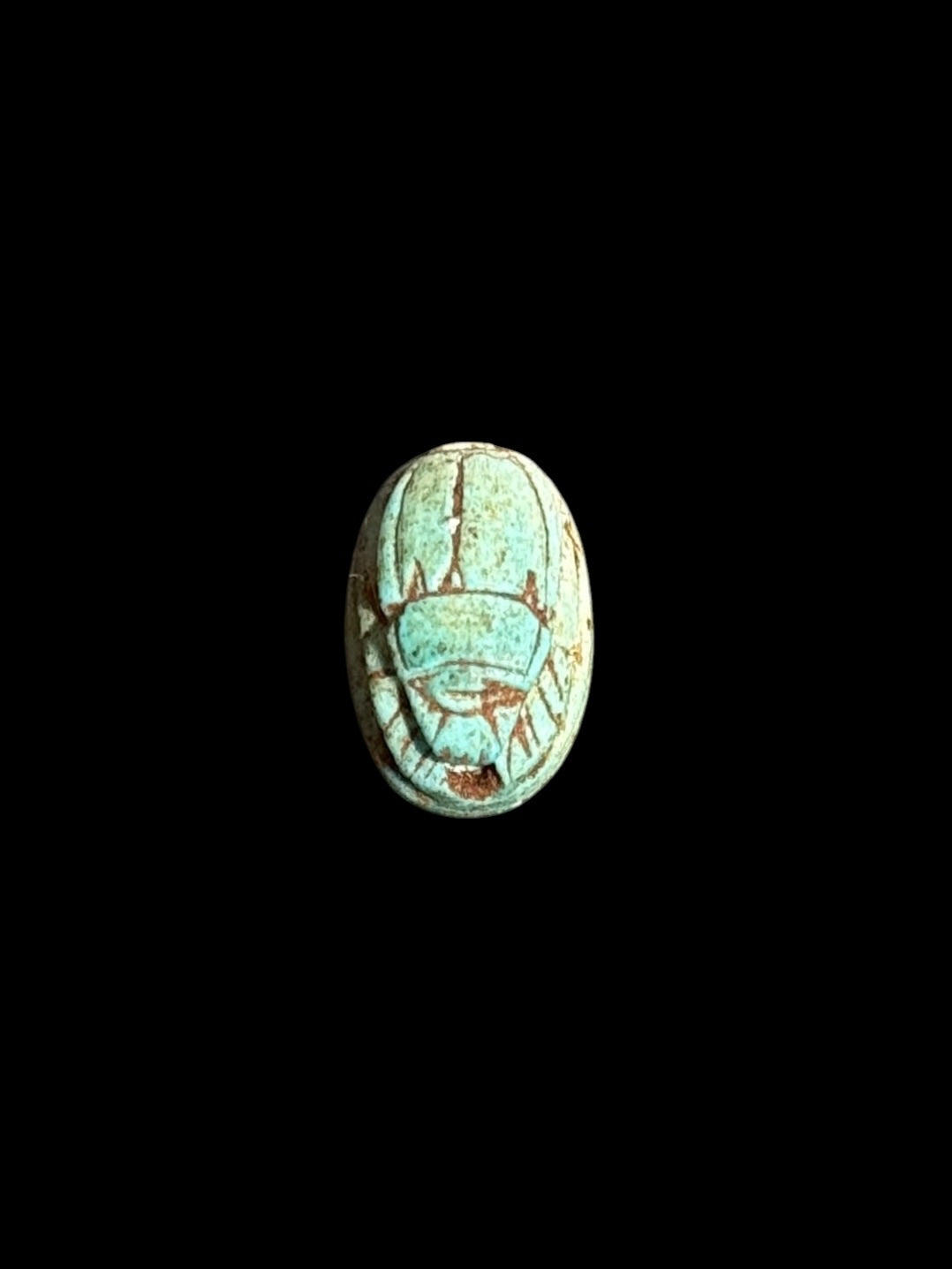 Top view of Egyptian scarab SC-059, showing blue-green tones with darker outlines.
