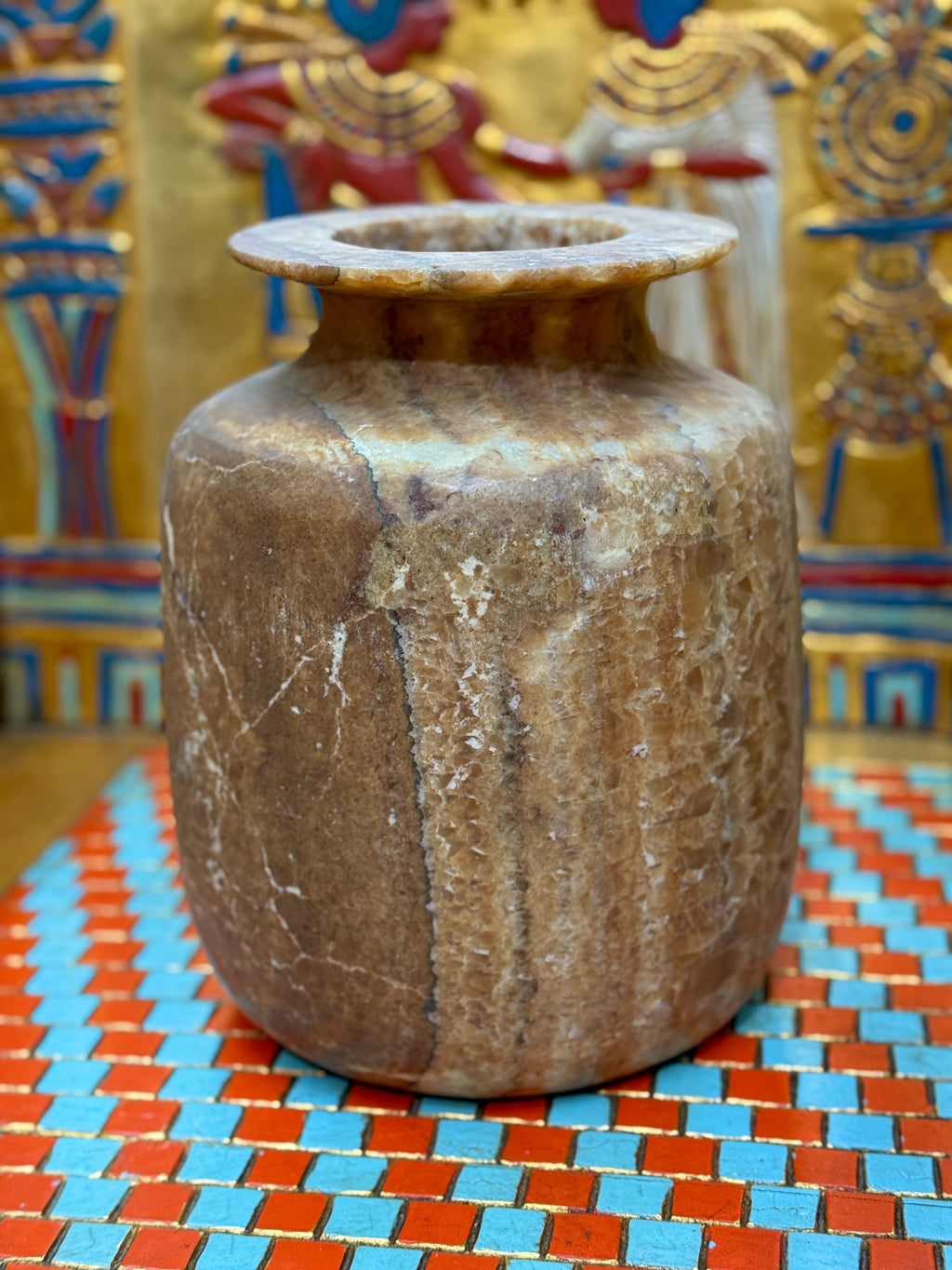 Squared alabaster vase with rounded corners, smoky brown stone, lighter vertical stripes and a flared rim — unlit full view.