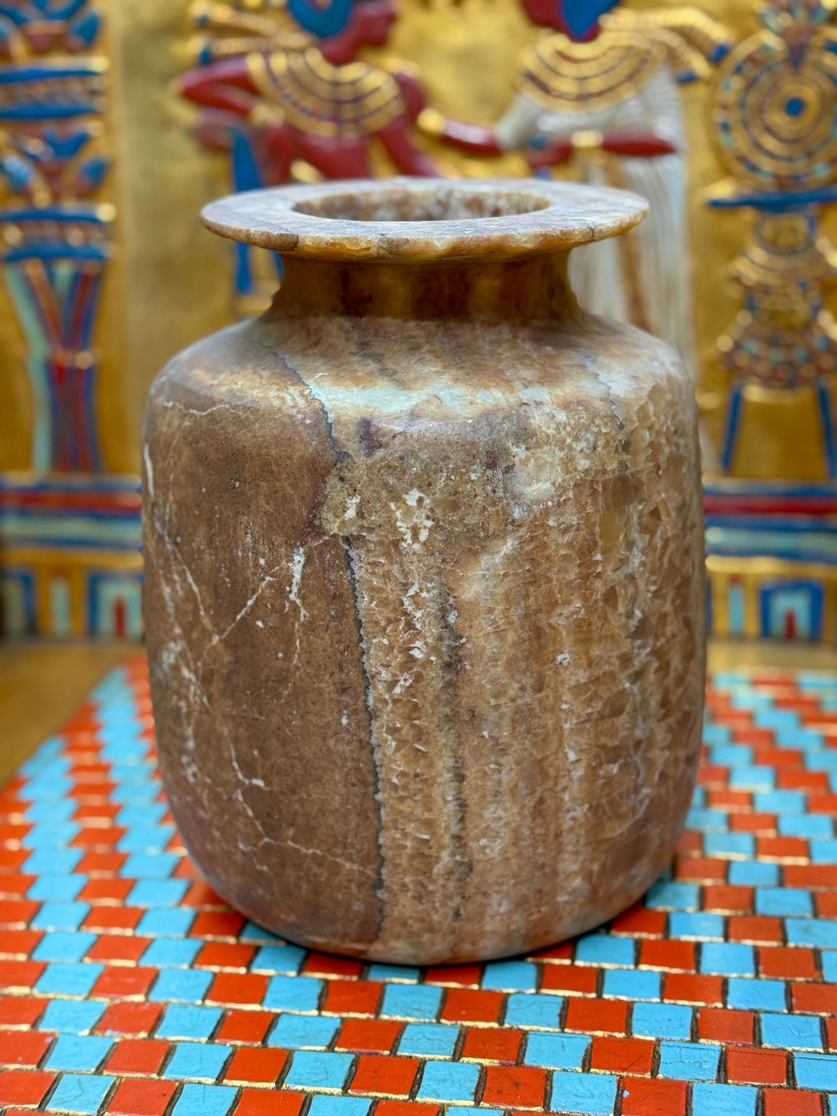 Squared alabaster vase with rounded corners, smoky brown stone, lighter vertical stripes and a flared rim — unlit full view.