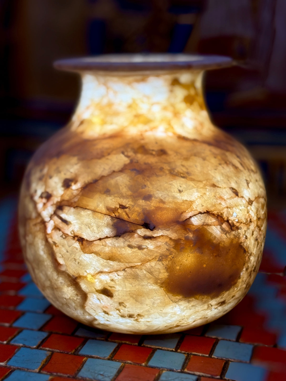 Small rounded alabaster vase with amber-coloured swirls, dark brown veining and a flared rim — additional view 1.