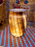 Tall alabaster vase with golden-coloured stripes, deep brown bands and a flared rim — full view.