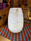 Tall cream alabaster vase with a gently curved body and pale honey-coloured veins — full view.