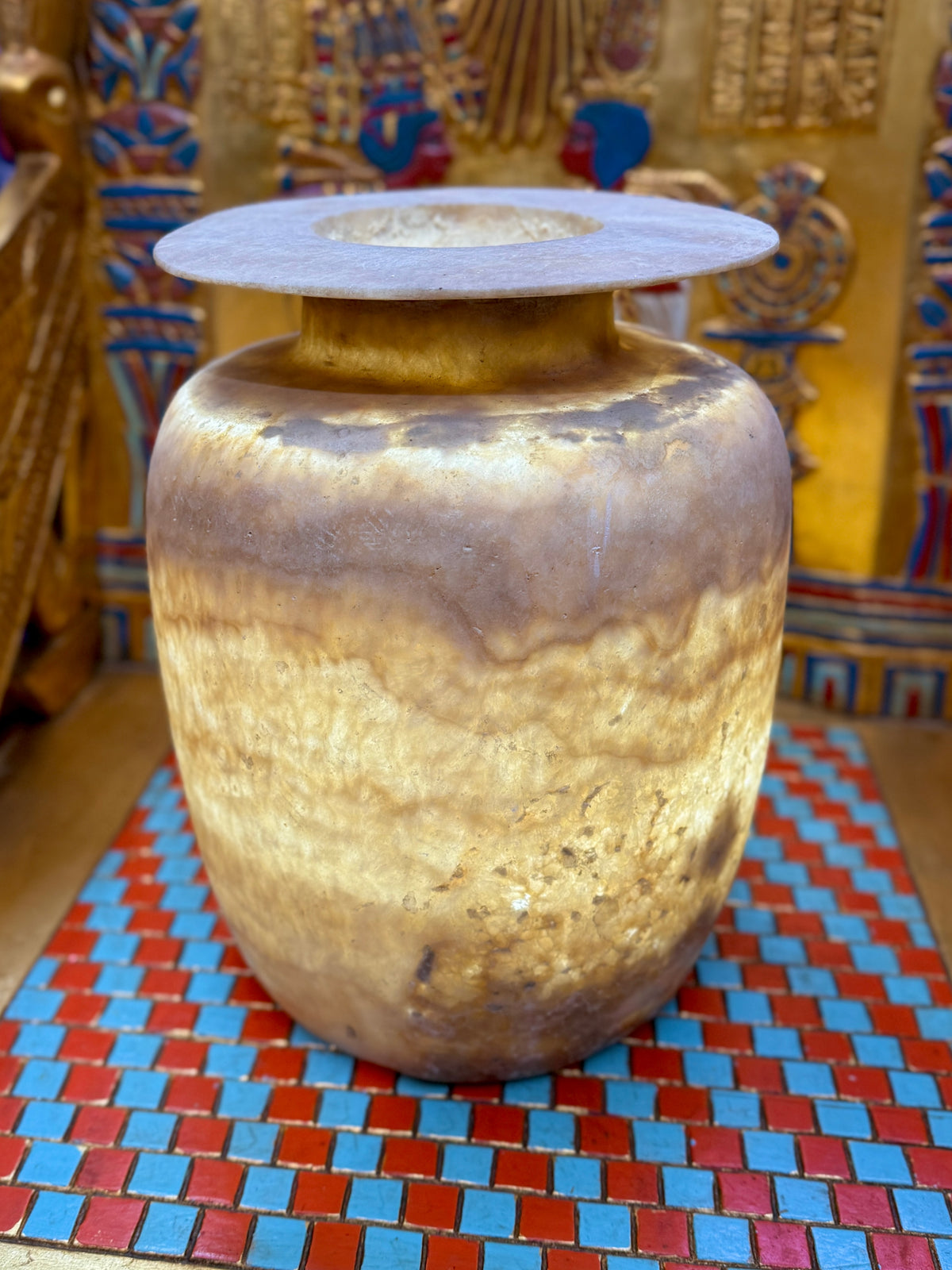 Large wide alabaster vase with smoky brown and pale honey bands, a low neck and broad flared rim — full view.