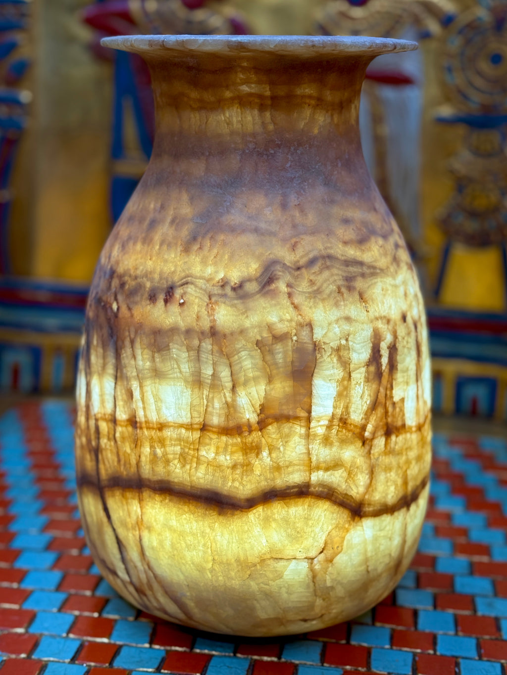 Tall alabaster vase with amber-brown horizontal bands, fine vertical veins and a flared rim — additional view 1.