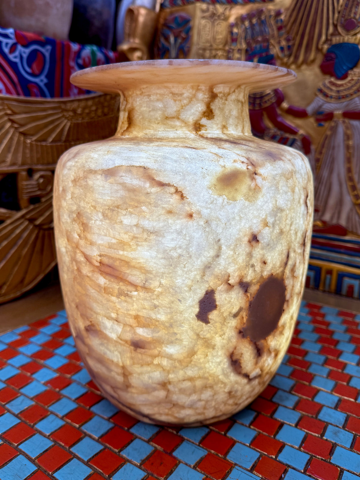 Broad alabaster vase with a low flared neck and layered honey, cream and brown veining — additional view 3.