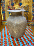 Smoky grey-brown alabaster vase with a tapering body, rounded shoulders and a broad flared rim — unlit full view.