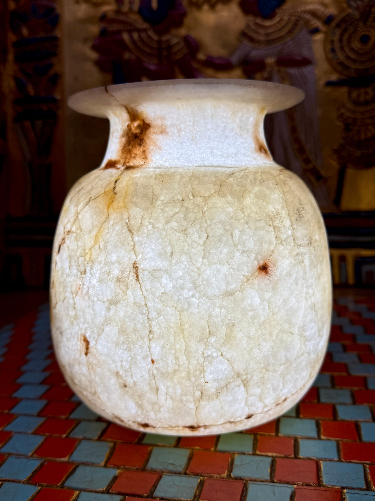 Cream alabaster vase with a rounded body, short neck, flared rim and fine golden veining — additional view 1.
