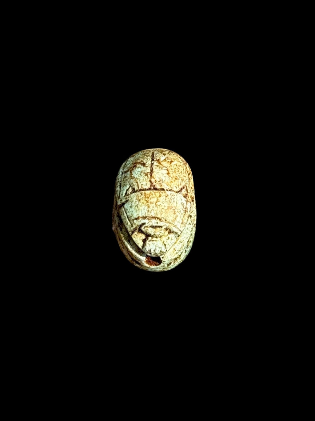 Top view of Egyptian scarab SC-050, showing pale green and cream tones.