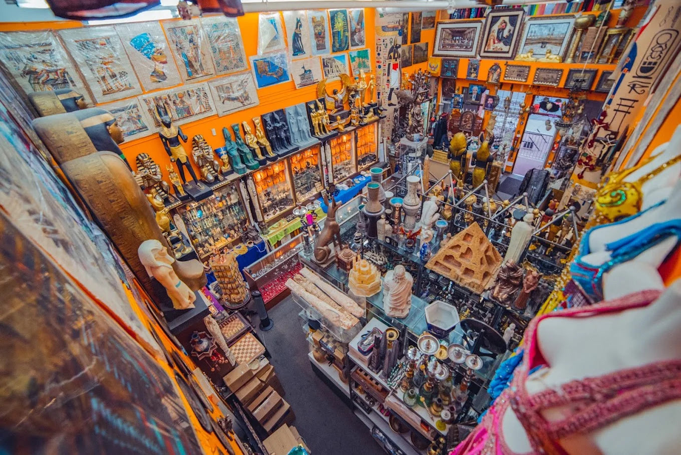 Overhead view inside Son of the Pharaoh, with Egyptian statues, papyrus artwork and glass display cabinets.